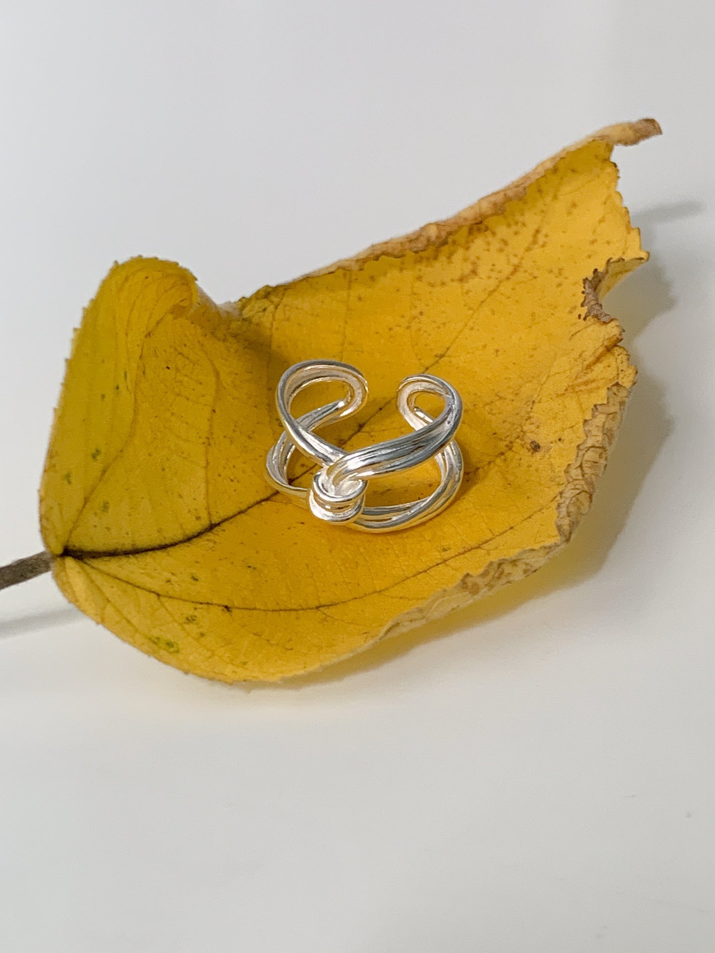 X Buckle Twist Ring